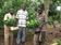 Beneficiaries accepting coffee seedlings from one of the founding directors of Eriro Foundation