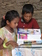 Orphan Children reading books which were given them by Rev.Matthew Suroya.