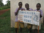 Picture of the Boys at the sign post of St. Mugagga Boys Home