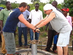 Drilling a borehole in the community.