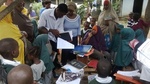 Children and parents in one of our partner schools