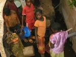 children in the village carrying water at the catchment