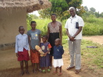 Moses Okeng The Director HOWCA,barbra ageno(a widow), and Her children at their home in Lira