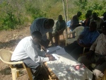 Rev. Isaac -Director of CADASAL signing the project contract