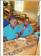 Children  in  our  group  taking  a  meal  after  attending  burial  of  one  of  the  orphans.