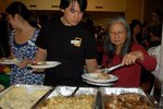 Serving Thanksgiving dinner (Source: https://www.facebook.com/photo.php?fbid=474066363023&set=a.105766893023.93556.73970658023&type=3&theater) 