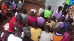Children attending class in temporary buildings