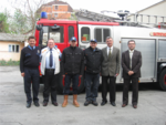 Serbian firefighters (centre) dressed in donated Scruffs workwear