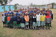 project orphan pose for a group photo.