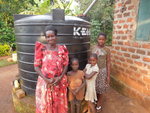 Family with their rainwater tank