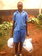 Emanuel  Bisonga  careying  a  donation  of  clothes  he  had  brought  street  children  we   got  admitted  in  his  but  lacked  uniforms
